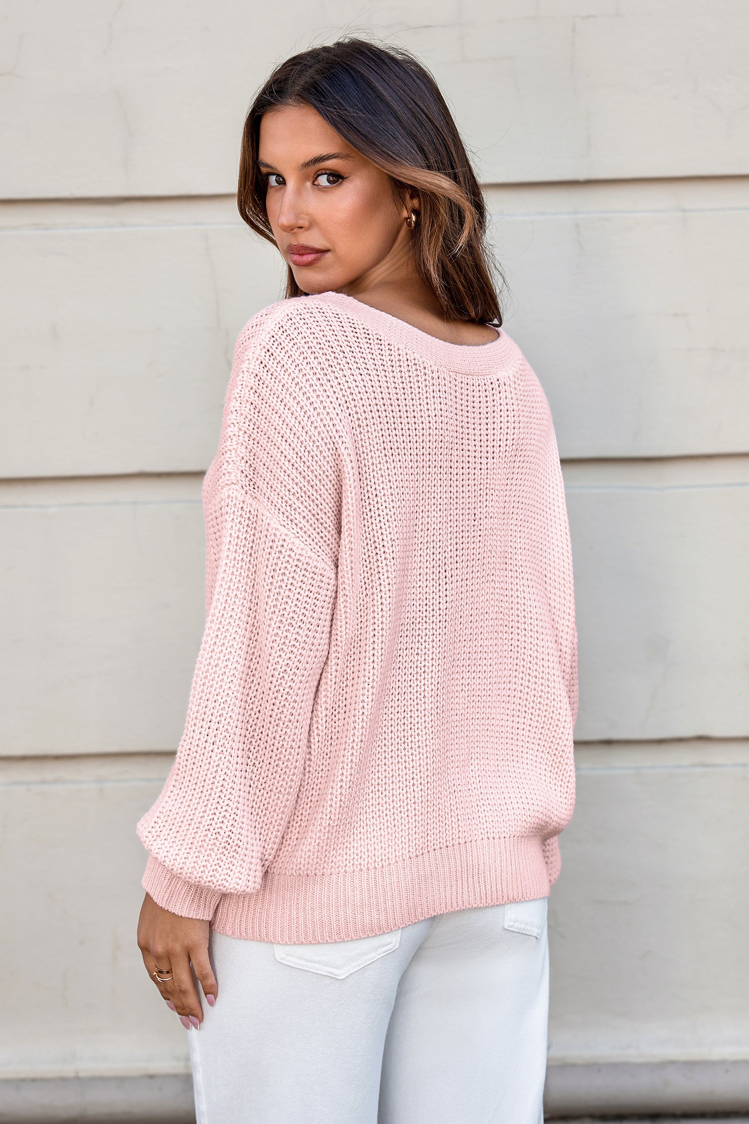Rosa Langarmpullover mit Schleife
