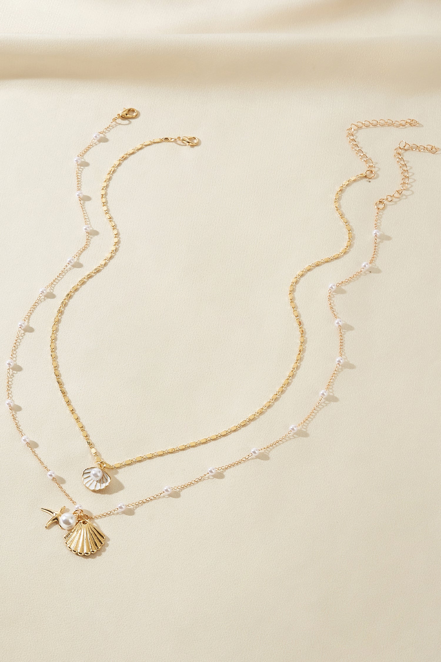 Goldfarbenes Halsketten-Set mit Strandmotiven