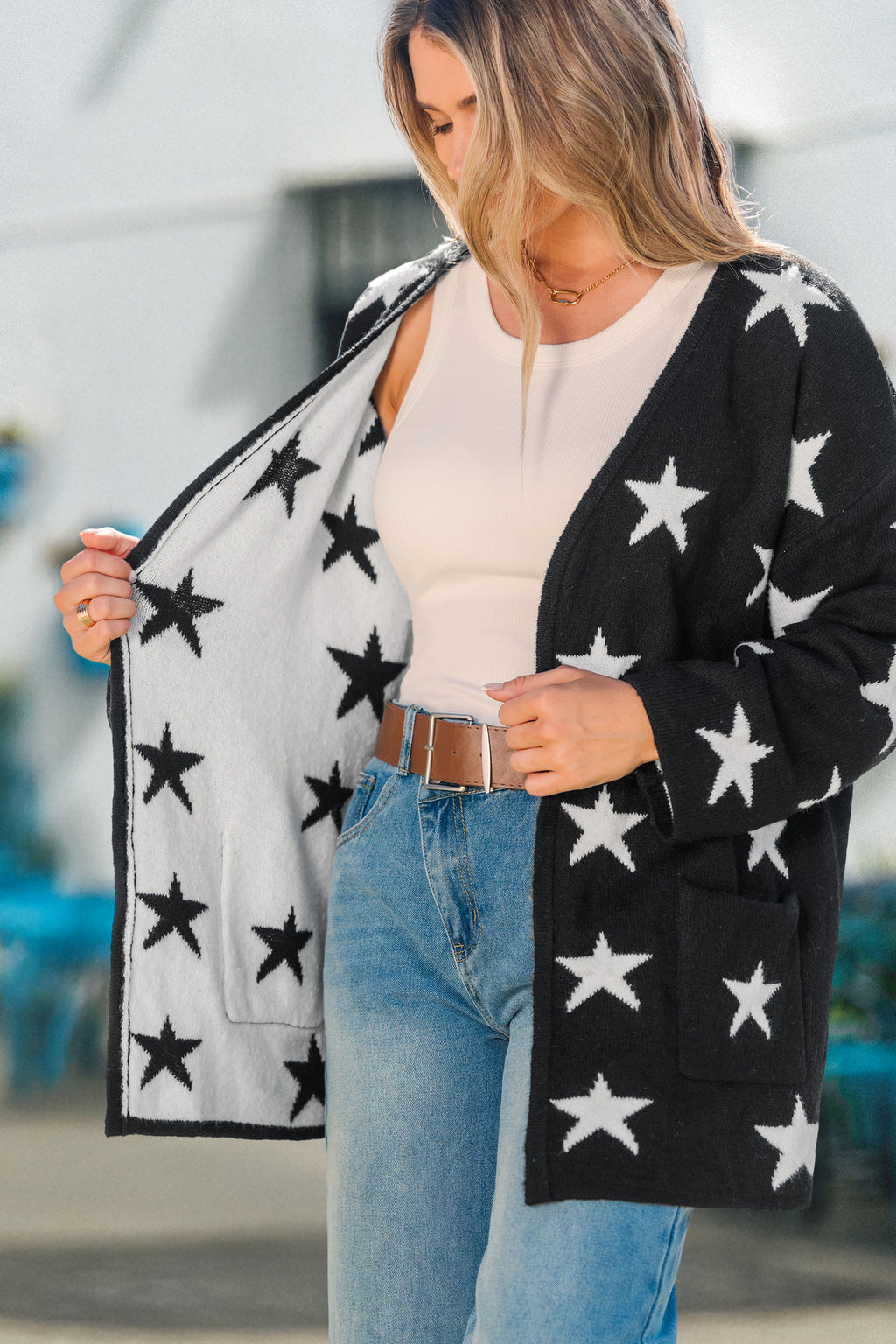 Schwarze Strickjacke mit Sternenprint